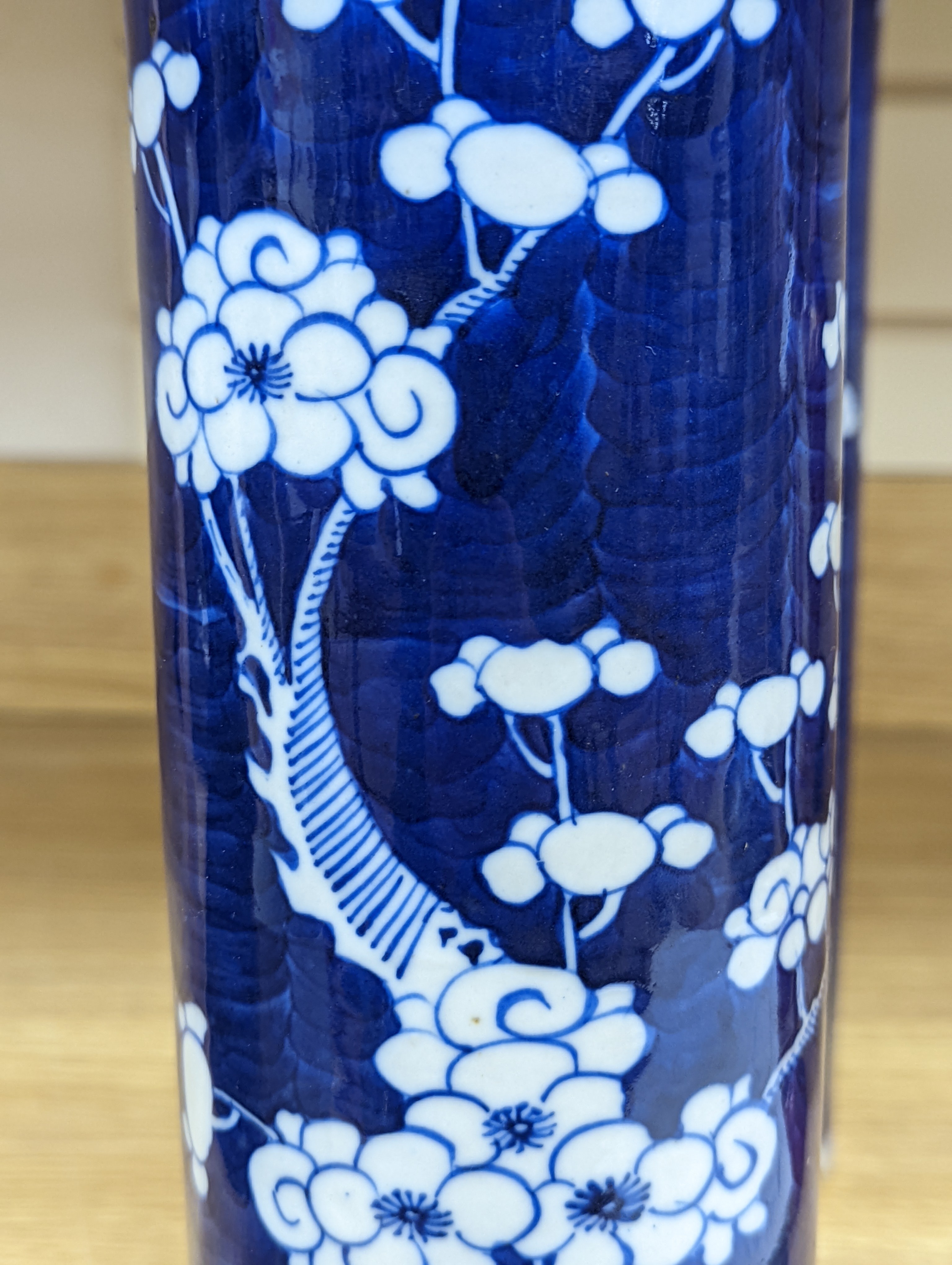 An 18th century Chinese famille rose mug, a Chinese Imari tea caddy and two Chinese blue and white sleeve vases 30cm (4)